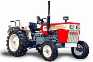 Red coloured swaraj tractor with white coloured tyres