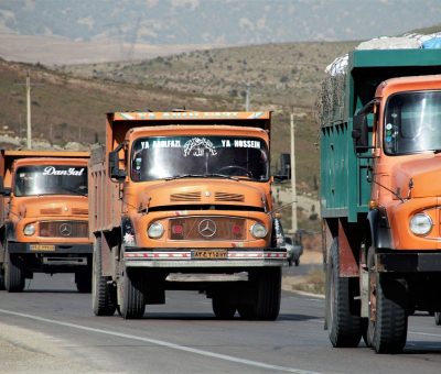 3 red colour trucks