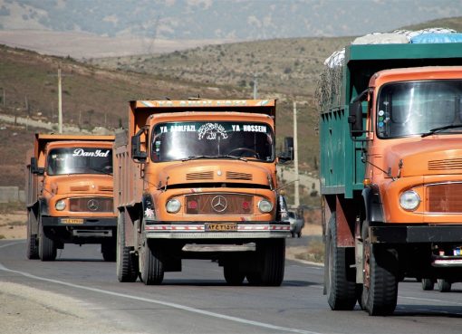 3 red colour trucks