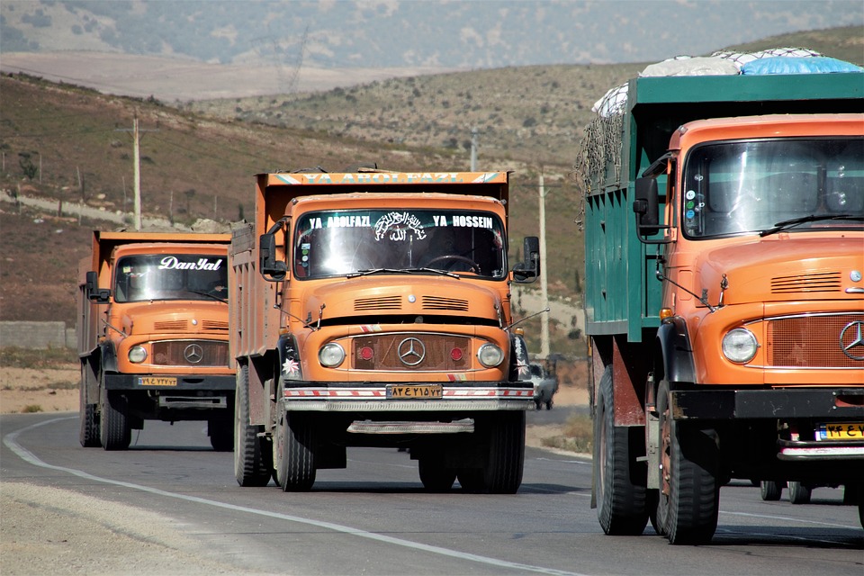 3 red colour trucks